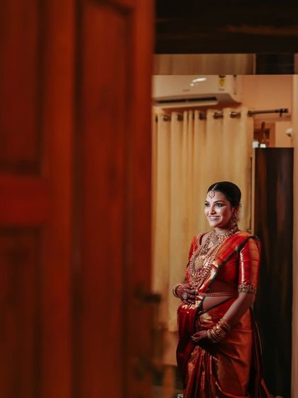A candid moment of anticipation and joy. Our sarees are designed to be a comfortable and elegant part of these unforgettable memories.