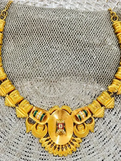 An heirloom in gold, gleaming through the decades. This timeless neckpiece has been a silent witness to 70 years of joy, passed from a grandmother to her daughter and now to her granddaughter.