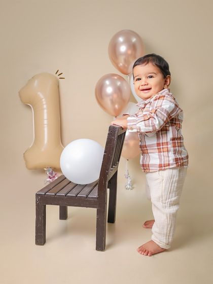 Taking his first wobbly steps during his first birthday shoot. This is a huge milestone, and I love capturing that sense of accomplishment.