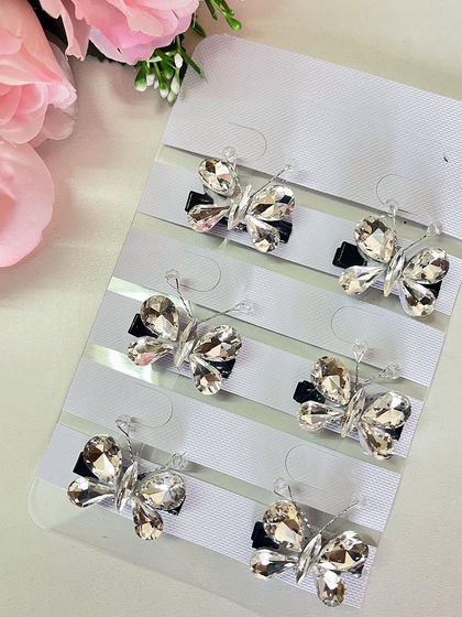 These silver stone butterfly clips are perfect for accessorizing a sleek bun or a modern braid.