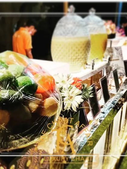 Our default setup includes beautiful flower decorations and illuminations. Here, you can see our naturally colored red and green Gol Gappas ready to be served, creating an eye-catching and inviting experience for guests.
