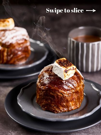 The steam rising from our Hot Chocolate Croissant Cake hints at the warm, gooey center. It's the perfect comfort dessert, combining the best of a croissant, a cake, and a cup of hot cocoa.