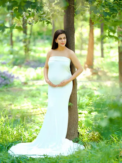 We love taking our sessions outdoors to capture the beauty of nature. This serene portrait was taken in a sun-dappled forest, using natural light to create a peaceful and organic feel.