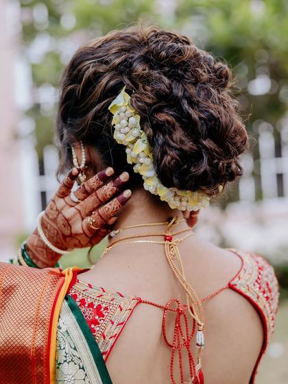 An intricate textured updo that I created for one of my favorite brides. This hairstyle is a work of art, perfect for a classic and elegant bridal look.