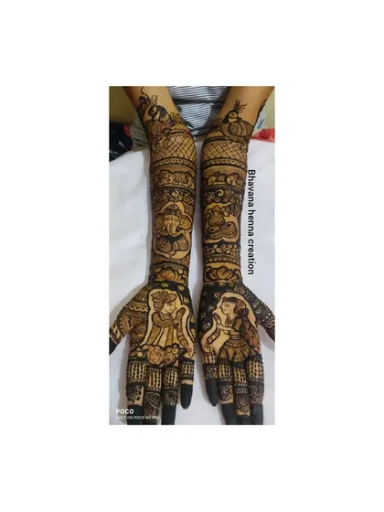 This design tells a complete story, with bride and groom portraits on the palms, Ganesha and elephant motifs on the forearms, and peacocks at the top.