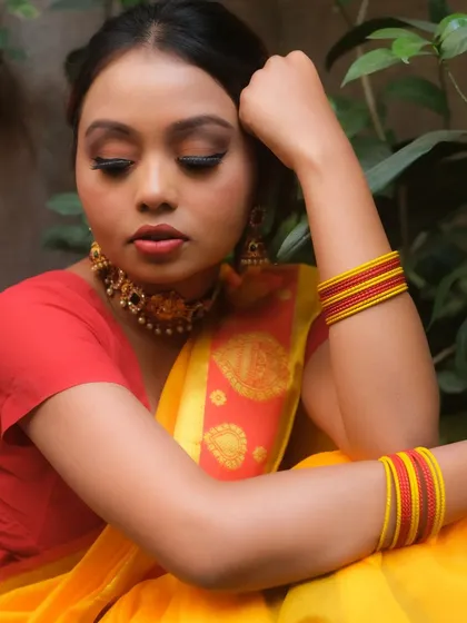 This shot highlights the elegant eye makeup, featuring long, dramatic lashes and expertly blended eyeshadow. It's a look that is both classic and captivating.