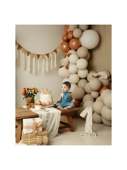 A quiet moment during a first birthday shoot. This little one sits patiently by his cake and presents, creating a calm and beautiful portrait amidst the celebration.