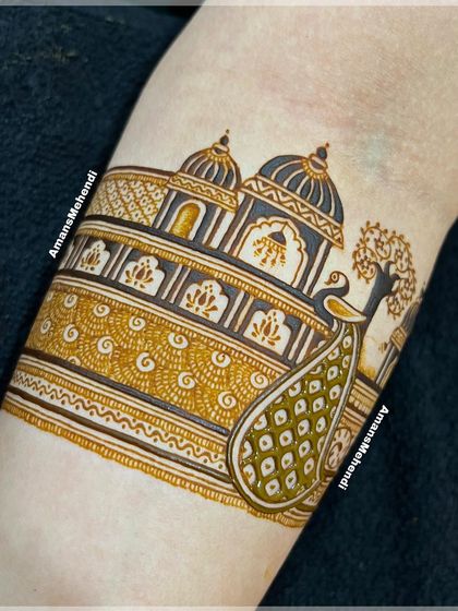 The design taking shape with shading and filling. The peacock's feathers and the palace architecture begin to come alive with depth and detail.