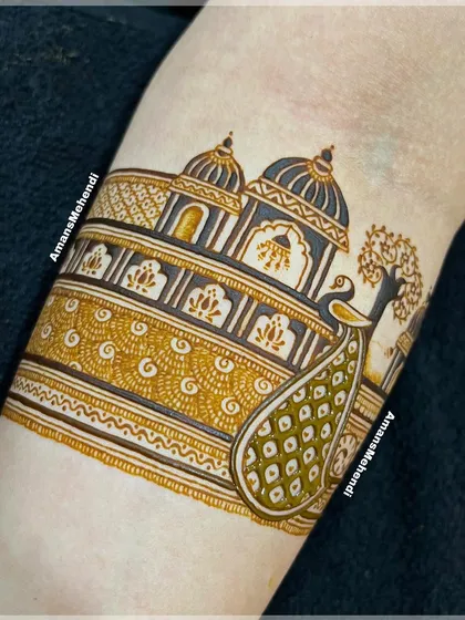 The design taking shape with shading and filling. The peacock's feathers and the palace architecture begin to come alive with depth and detail.