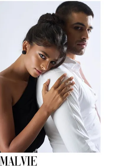 A tender moment from the Malvie editorial. This close-up in black and white emphasizes the emotional connection between the couple, with the simple black stud earring on the female model adding a subtle point of interest.