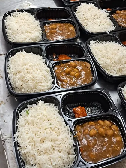 A close up of our popular Jeera Rice and Chole Masala meal boxes. We ensure every meal is packed fresh, hot, and hygienically, perfect for corporate lunches or institutional catering.
