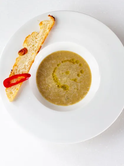 A rustic lentil soup served with a crusty piece of bread. Soups are the ultimate comfort food, and we explore variations from around the world.