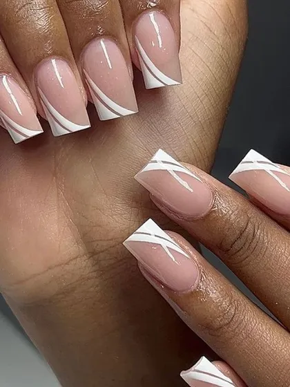 A modern and graphic design with clean white lines over a nude base on square nails.