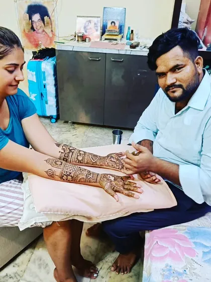 This is me, Kapil, at work. I provide a comfortable and professional mehendi service right in your home, so you can relax while I create the perfect design for your occasion.