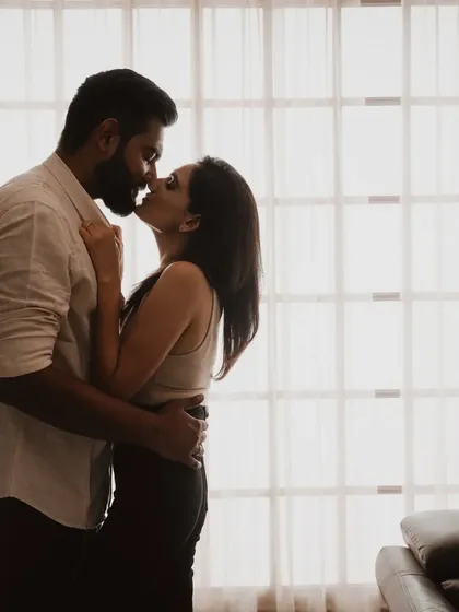 A close-up silhouette against the window, capturing the intimacy of a kiss. This shot is all about feeling, stripping away all distractions to focus on the quiet, powerful bond you share.