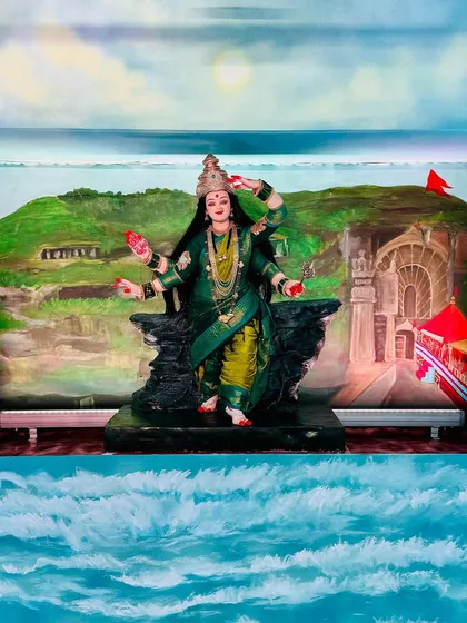 This is a full view of my Aagri Koli themed Navratri installation. My goal was to wrap the entire room in art, from the hand-painted waves on the floor to the depiction of Ekvira Mauli's temple in the background, celebrating my cultural roots.