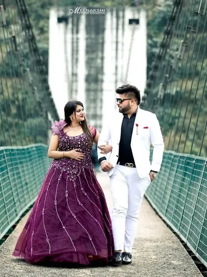 A stylish couple walks across a suspension bridge, surrounded by the lush greenery of the Rishikesh hills. I use these architectural elements to frame your story and add a sense of adventure to your pre-wedding album.