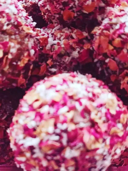A healthy and guilt-free dessert option. These apple date cinnamon laddoos are crusted with fragrant rose petals and contain no added sugar, oil, or dairy.