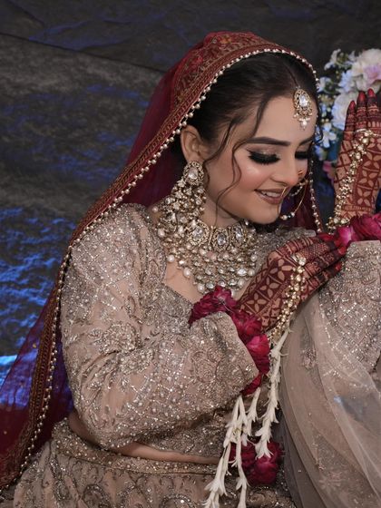 The bride's happiness shines through in this photo. The makeup is soft and radiant.