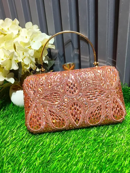 The right accessory completes the look. This rose gold, paisley-patterned box clutch is one of many unique, imported pieces I have that you can rent or buy to match your outfit.
