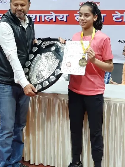 Another shot of Ananya Chande with her winner's shield at the inter-school table tennis competition. She is a role model for her peers.