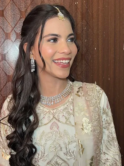 A candid smile from this client, looking radiant for her event.