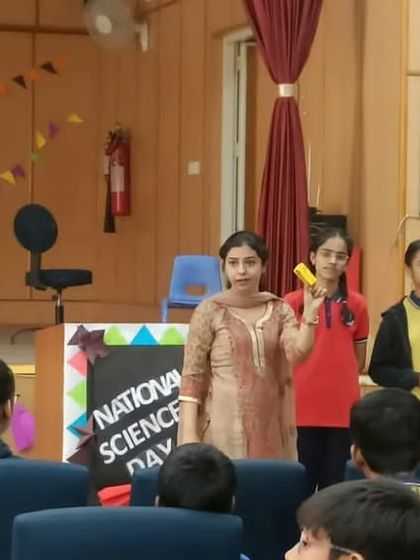 A fun activity during a workshop at a school, where students and teachers participate in a game to learn about food facts.