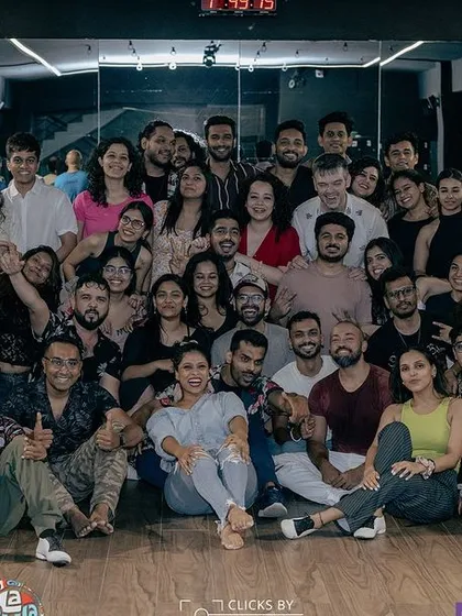 The community is the heart of what we do. This is a group photo from one of our workshops, filled with happy faces and so much positive energy. When you join our classes, you join a family.