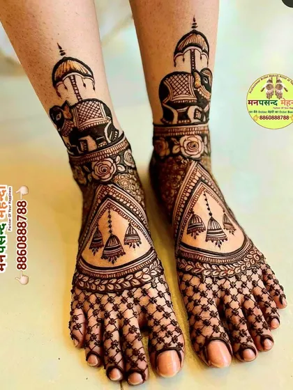 An elegant bridal foot mehndi design featuring decorated elephants and beautiful hanging jhumkis. The intricate net pattern on the toes and the detailed ankle design ensure your feet look just as stunning as your hands.