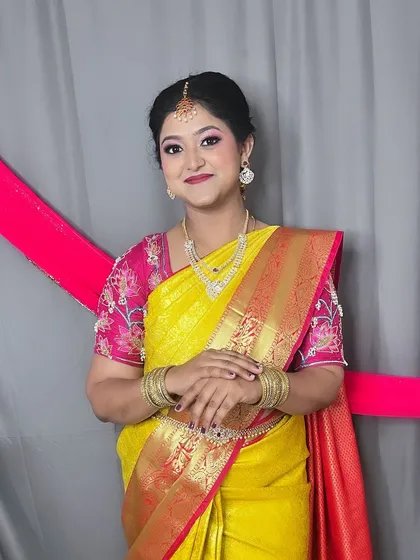A full view of the completed look for a family function. The makeup is balanced to look elegant both in person and in photos.