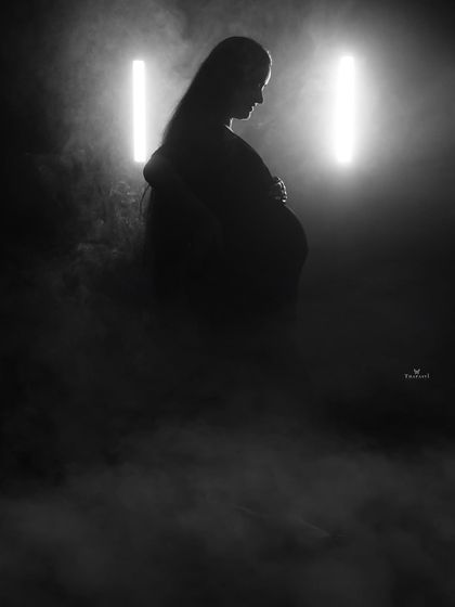 A powerful silhouette created with smoke and dramatic backlighting. This black and white image is all about form and atmosphere, creating a mysterious and beautiful portrait.