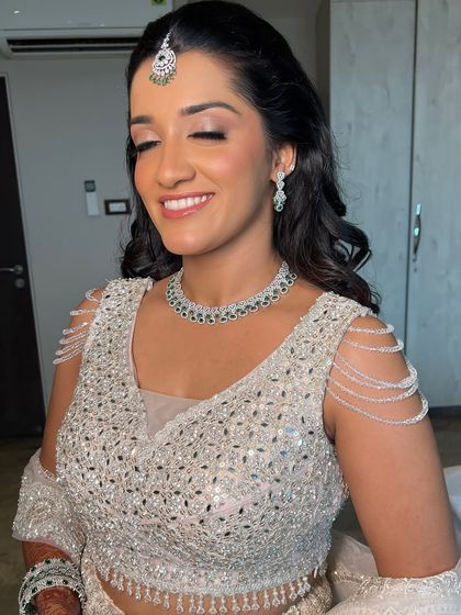 For her engagement day, she wanted to feel like herself, just softer and glowier. We kept it clean with fresh skin and soft lids to match her diamond glow.