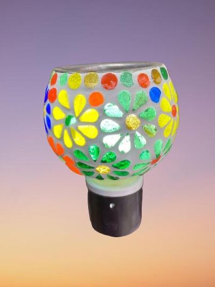 Another one of our floral designs, this mosaic lamp showcases a pattern of yellow and green flowers. The handcrafted nature means each lamp has its own unique charm and character.