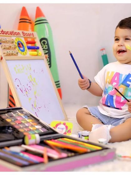 Unleashing the inner artist! This creative setup with an easel, paints, and crayons is perfect for capturing your child's colorful imagination at play.