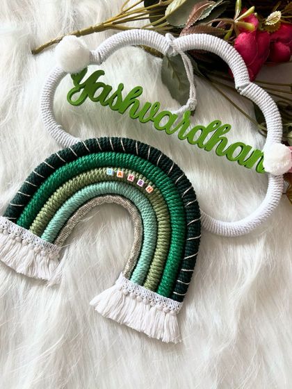 This image shows the full "Yashwardhan" name hanging, giving a clear view of its size and design. It’s a substantial piece that makes a statement on any wall.