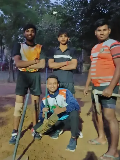 A group of players after a session of preparing the ground. This teaches them discipline and humility.