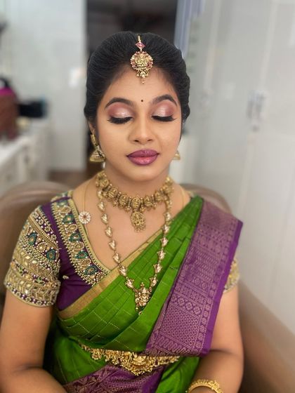 A beautiful makeover for my best friend for her brother's wedding. The look features a glamorous pink eyeshadow and a bold lip, perfect for the festive occasion.