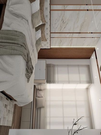 A vertically oriented view of a bedroom, showing the tufted headboard, marble and rose gold wardrobe details, and large windows that fill the space with light.