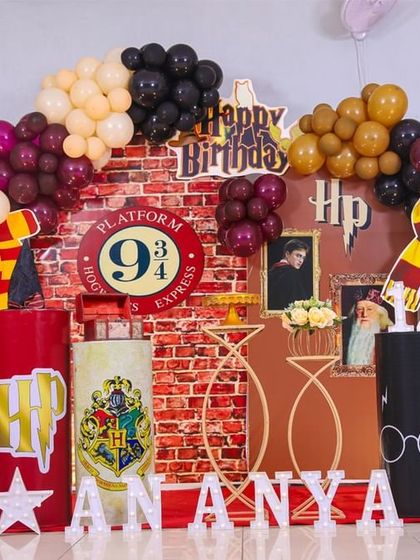 A detailed look at our Harry Potter themed party setup. We included iconic elements like the Platform 9 3/4 sign, house banners, and themed props to transport guests straight to the wizarding world.