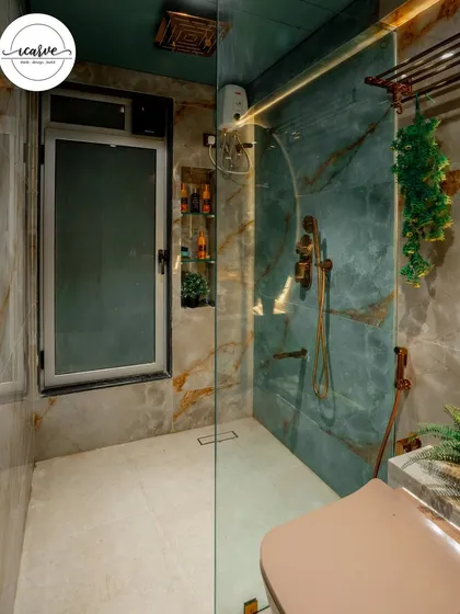 The walk-in shower area is spacious and features a built-in niche for toiletries, keeping the space organized and clutter-free.