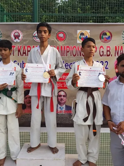 The podium for a sub-junior category at the district championship, with our students taking gold and silver.