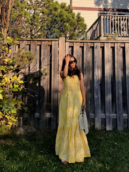 A candid moment adjusting my hair, making the photoshoot feel more natural.