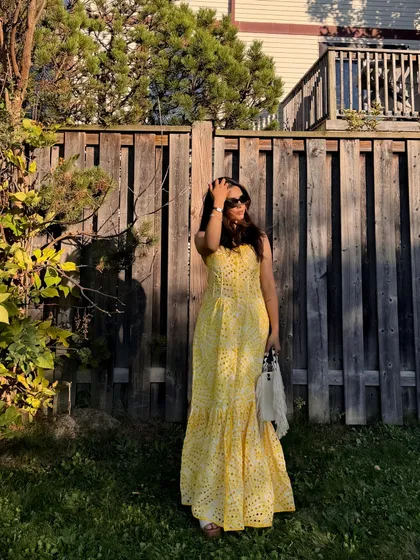 A candid moment adjusting my hair, making the photoshoot feel more natural.