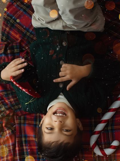 A playful, upside-down view of Christmas joy. I love capturing the silly, carefree moments that show a child's true personality during our sessions.