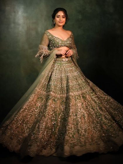 A full-length shot of the stunning green lehenga, perfect for a festive occasion or a reception.