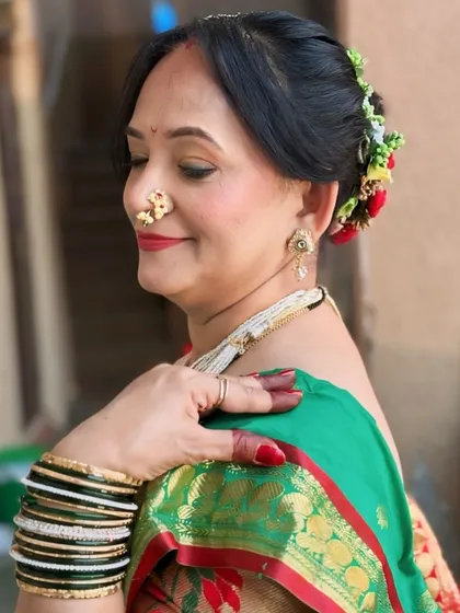 This client has naturally beautiful and fair skin. I used a light touch to enhance her features for this traditional Maharashtrian look, letting her own beauty shine.