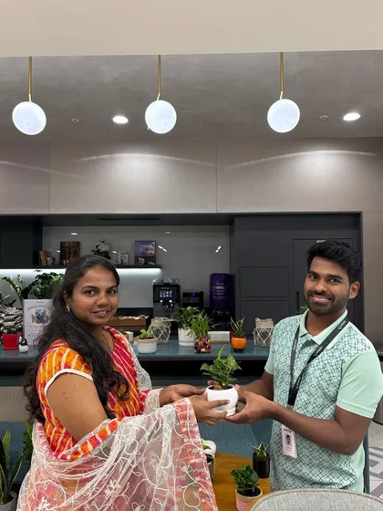 The best part of my job is seeing a happy client with their new plant. Here I am handing over a freshly potted plant, ready to go to its new home. I make sure every customer leaves with the knowledge to care for their new green buddy.