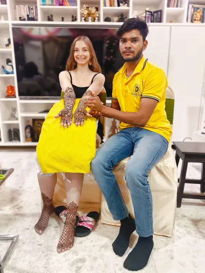 One of my senior artists with our international client. We are proud to share our traditional art with people from all cultures.