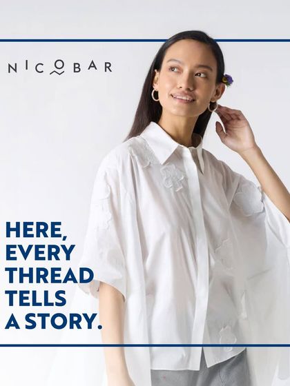 Showcasing a beautifully crafted white shirt from Nicobar with subtle embroidery. It represents their belief that every thread tells a story of quality and care.