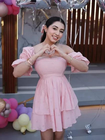 We were honored to create the decor for this special 100k followers celebration. Here is the lovely influencer posing with the vibrant balloon setup we designed for her milestone.